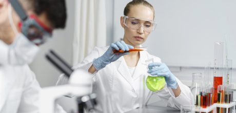 female-researcher-laboratory-with-test-tubes-male-colleague